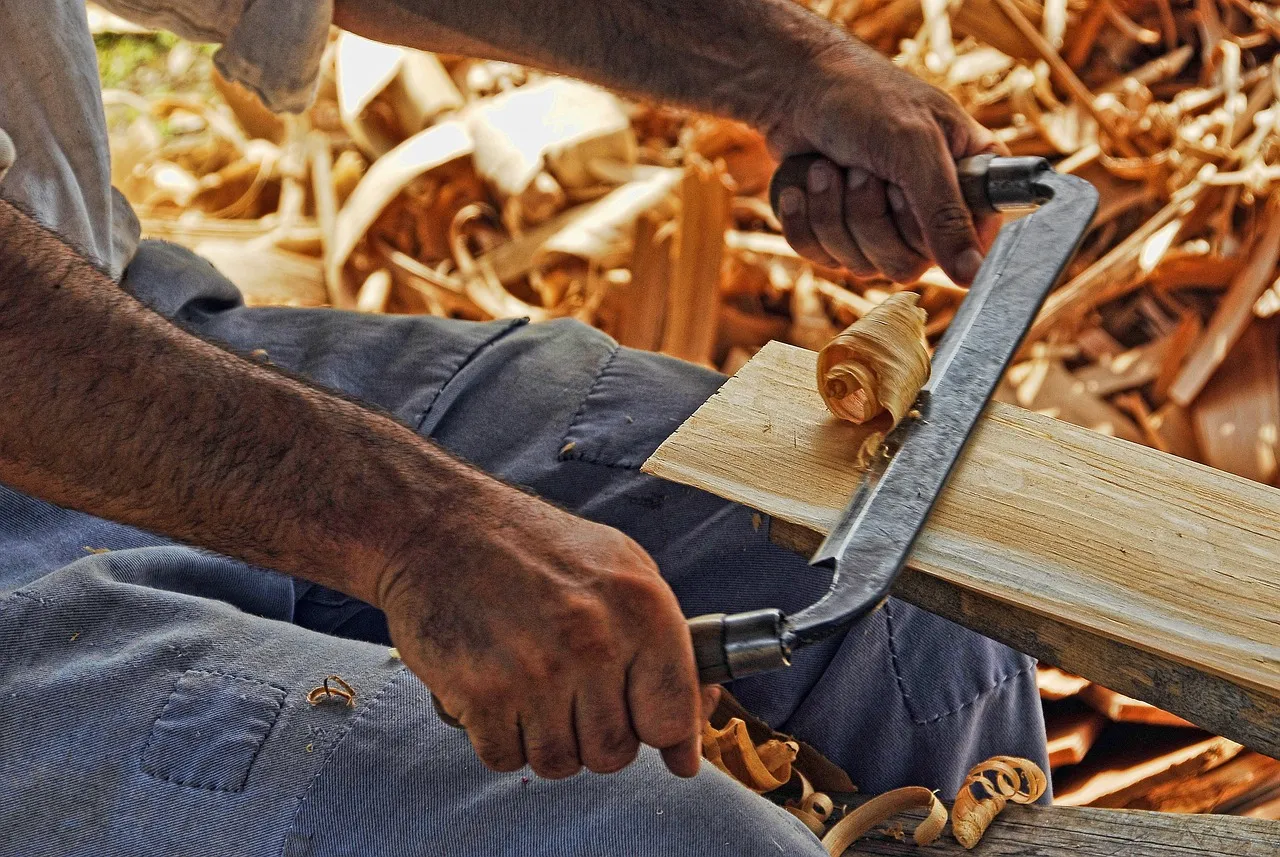 A hand plane and shavings on a workbench